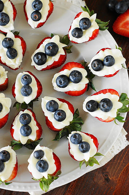 Close-Up Top View of Red White & Blue Strawberry Cheesecake Bites Image