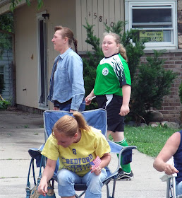 chubby soccer girl walking along the parade