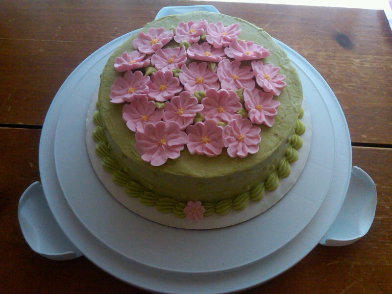 This is a Green Tea cake with Buttercream Frosting and Royal Icing Flowers