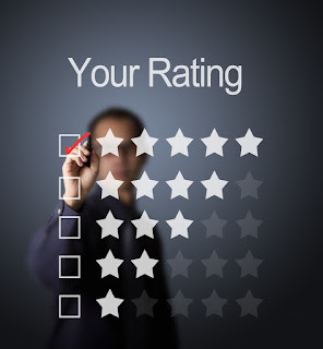 A businessman is checking the box with 5 stars to indicate the optimum timing for employee engagement surveys