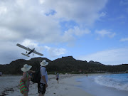 The airport runway in St Barths ends at the beach as you can tell by this . (st barths airport and beach)