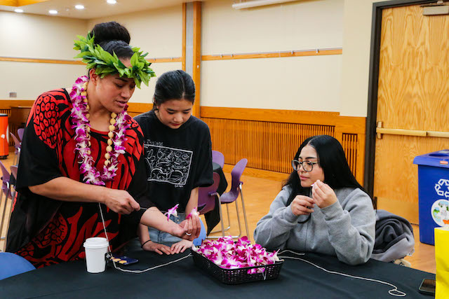 SLCC community learning the art of making lei's