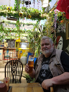Artist Roger Gregory drinking cold lager