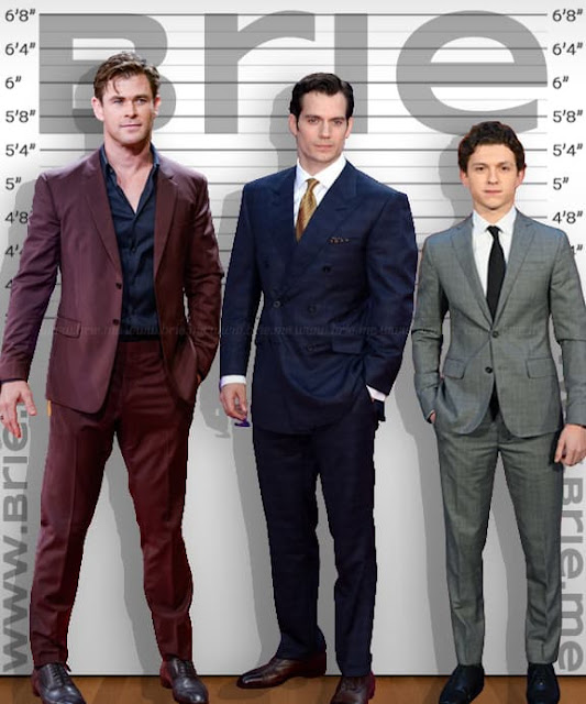 Henry Cavill standing with Chris Hemsworth and Tom Holland