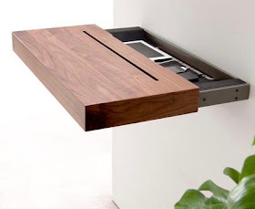 wood shelf pulled out from the wall showing the interior with two products charging inside