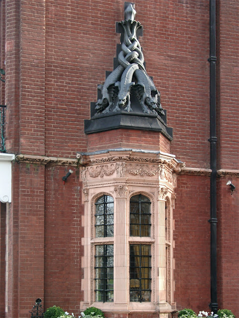 Bow window with monsters, Kensington Court, London