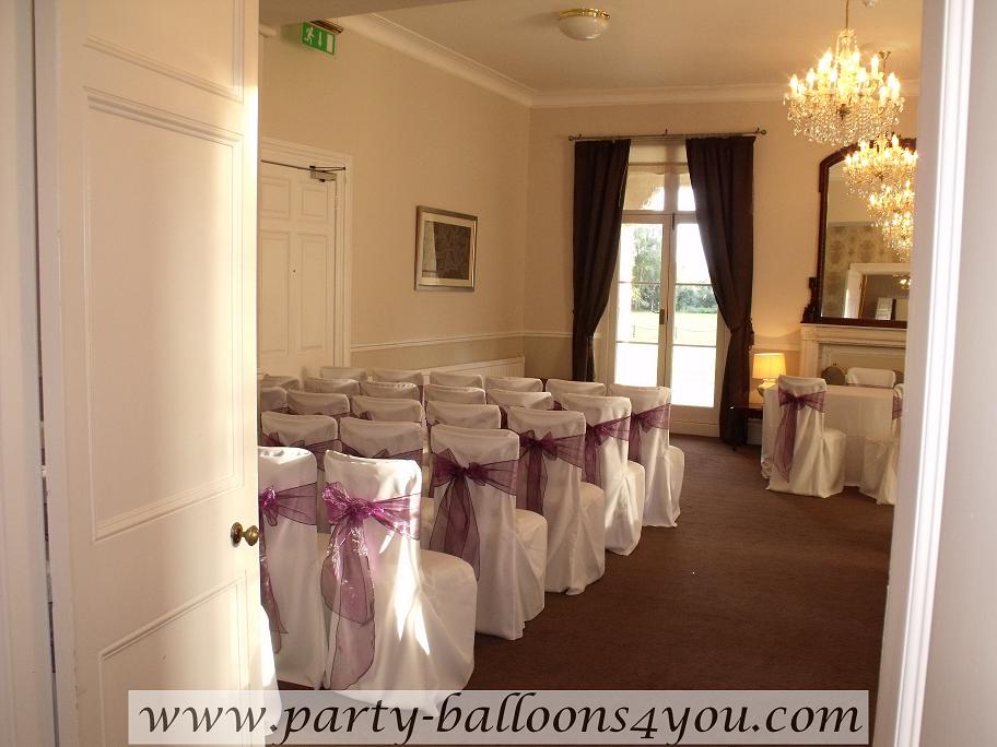 White Chair Cover with a Plum Organza Sash Bow