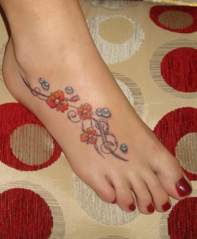 cute flower tattoos. Cute flower tattoo for feet