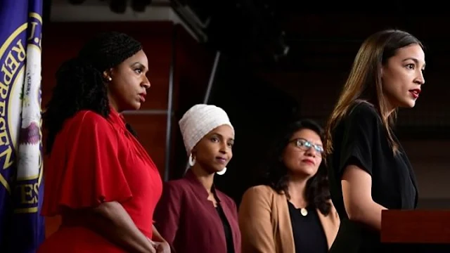 Image Attribute: "The Squad" - L-R->  Ayanna Pressley (D-MA 7th District), Ilhan Omar (D-MN 5th District), Rashida Tlaib (D-MI 13th District), Alexandria Ocasio-Cortez (D-NY 14th District) during a press conference at the U.S. Capitol on July 15, 2019. / Source: Alex Wroblewski, Getty Images