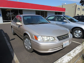 Dull, faded car paint on Toyota Camry.