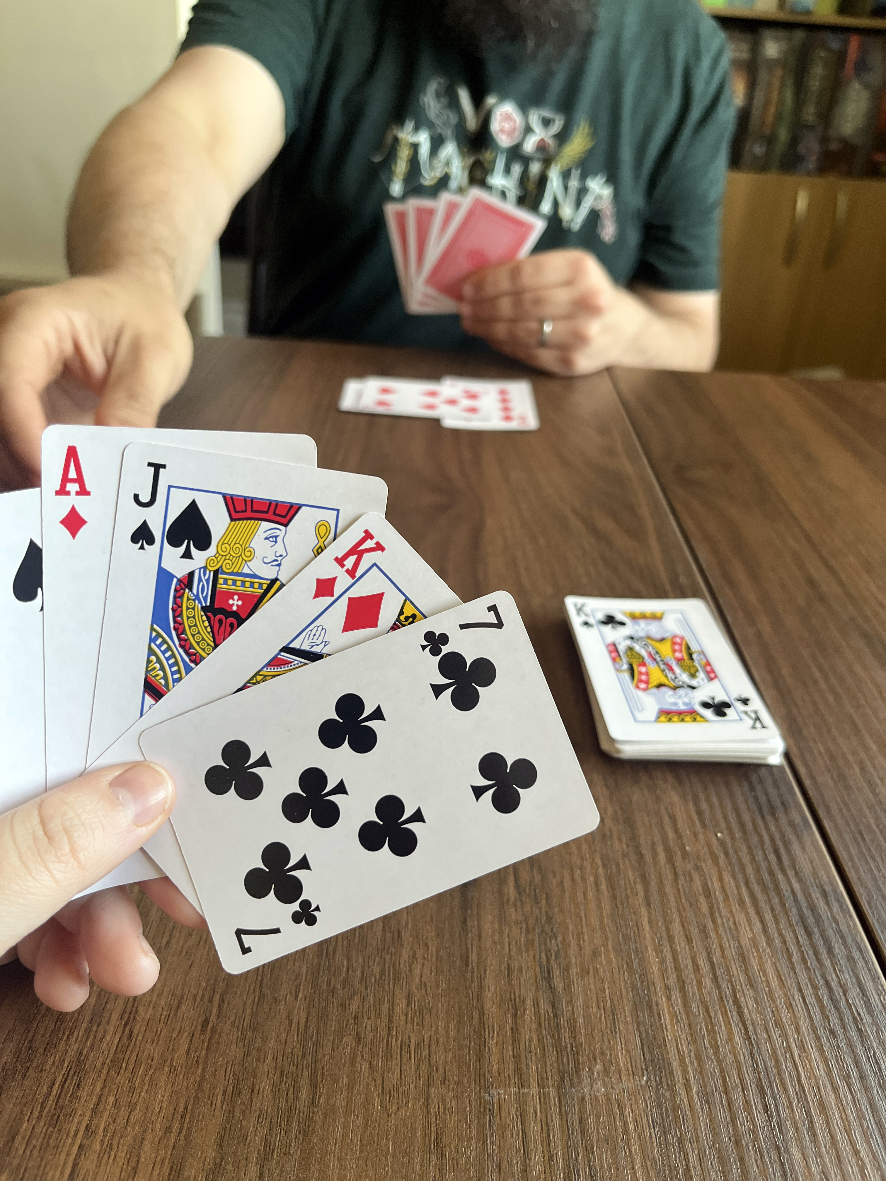 Two people playing Knockout Whist.