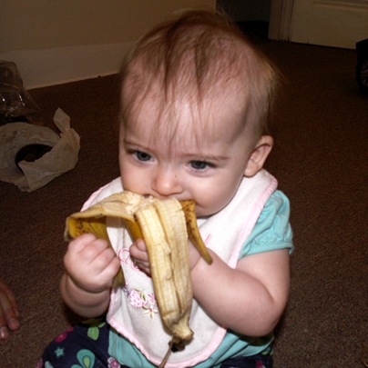 Elaine 6 months eating banana