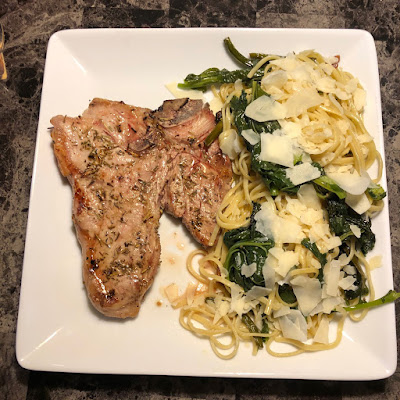 Grilled veal loin chop with some linguine tossed with garlic scapes and broccoli rabe