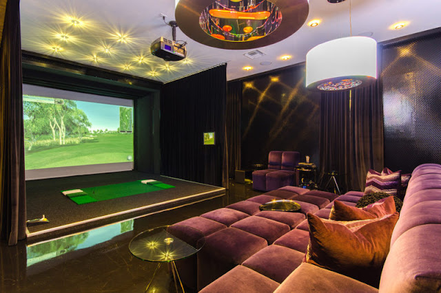 Celine Dion's Florida mansion purple velvet sectional in media room