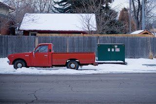 Red truck parked in a neighborhood street in Longmont