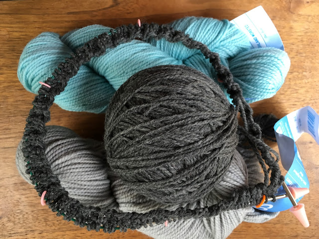 3 colors of yarn and a circular needle