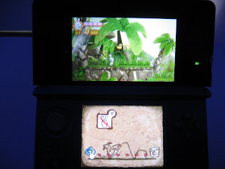 Nintendo 3DS console showing Raving Rabbids Travel in Time