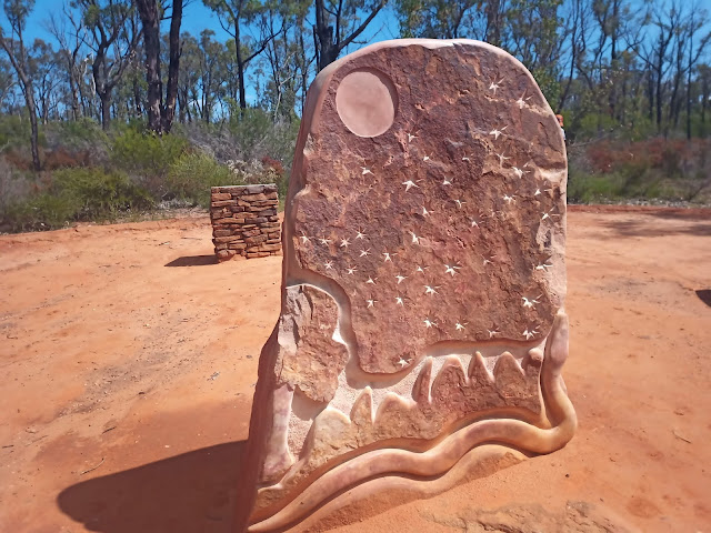 Sandstone sculpture showing moon and stars in night sky