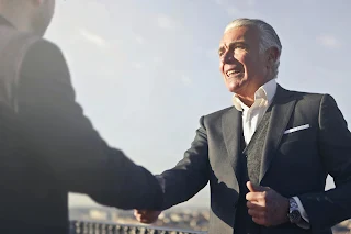 Photo by Andrea Piacquadio: https://www.pexels.com/photo/man-in-black-suit-shaking-hands-with-another-man-3781895/