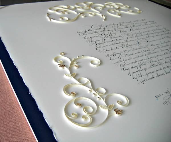 cream and gold quilling on wedding ketubot with text written incalligraphy