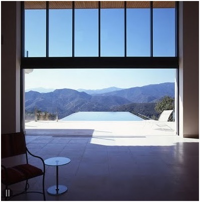 Wooden decks on a poolside. Swimming pool with a beautiful view to countryside