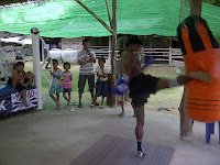 Buakaw kick a heavy bag