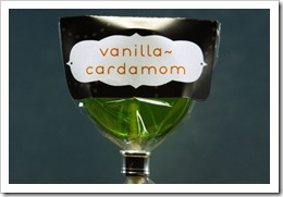 vanilla-cardamom lollipop in a charcoal gray wrapper