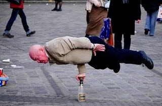 Grandfather Balancing on Bottle Illusion