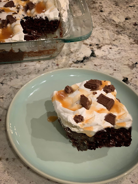 Irresistible Symphony Cake, devil's food chocolate cake mix, infused with sweetened condensed milk, topped with whipped topping, drizzled with caramel ice cream topping, and sprinkled with chopped chocolate symphony candy bars.  Delectable.