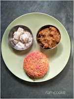 A special lunch platter consisting of beetroot rice, spicy chicken curry and shahi paneer