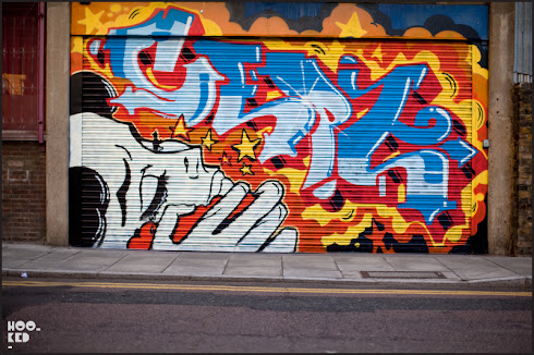 Roller SHutter Street Art in East London by artist Cept