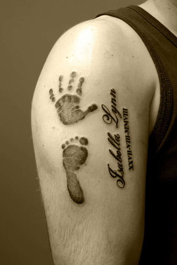 baby footprints tattoo. aby footprints tattooed