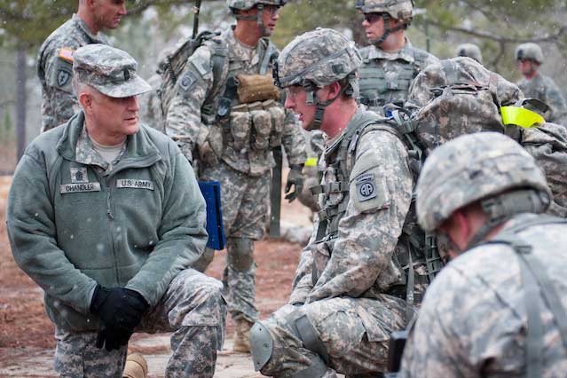 Sgt. Maj. of the Army Raymond F. Chandler III, left, talks small unit leadership with squad and team leaders of the 2nd Battalion, 501st Parachute Infantry Regiment, in the Fort Bragg training area. (U.S. Army photo by Staff Sgt. Charles Crail/XVIII Airborne Corps)