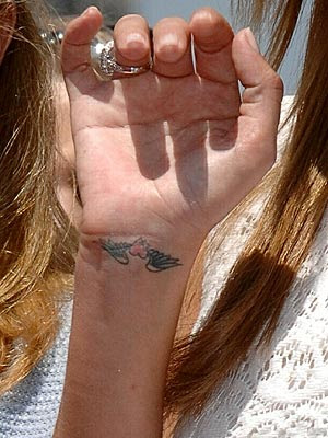  has four visible tattoos on her body including a heart with angel wings 