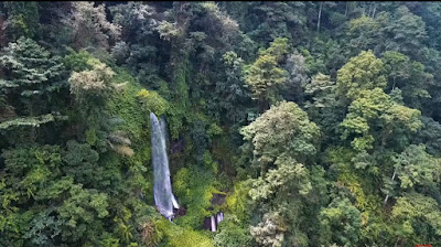 A royalty free of aerial drone shot of Sendang Gile Waterfall