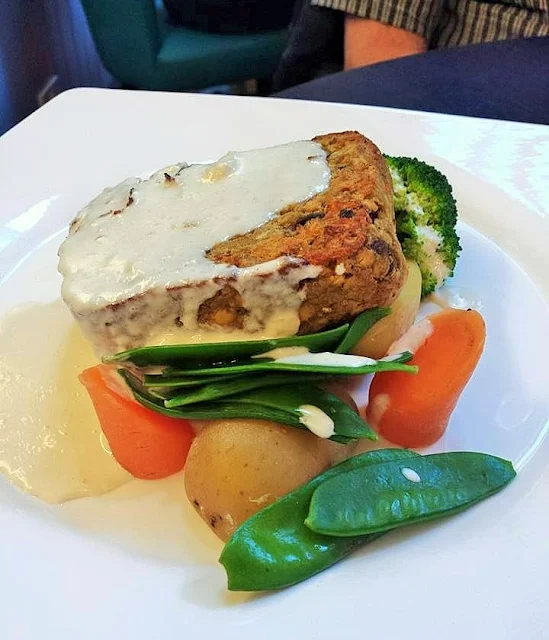 Lentil Loaf - a nut loaf made with vegetarian haggis and lentils served with vegetables and whisky sauce at the Atholl Arms Hotel in Dunkeld