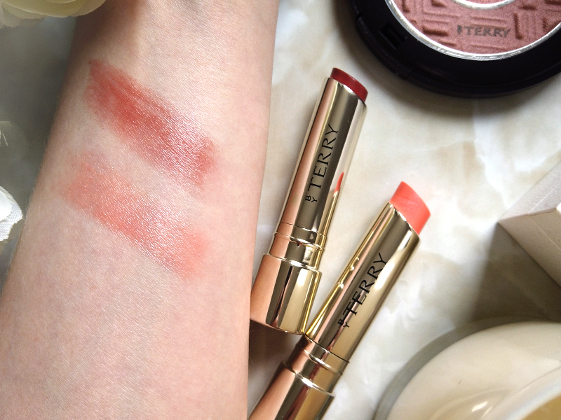 By Terry Hyaluronic Sheer Nude Hydra-Balm Fill & Plump Lipstick in shade Flush Contour and Innocent Kiss colour swatch on arm