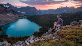 Man sitting alone thinking in the mountains