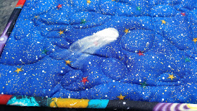 Painted comet on Solar system quilt