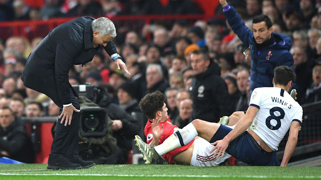 Jose Mourinho grimaces in pain after an accidental collision with Daniel James during Manchester United 2-1 Tottenham Hotspur in the Premier League