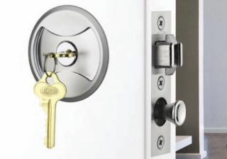 Pocket door lock with key