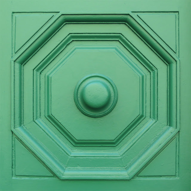 A detail of the green of the front door of the Cisternino, Piazza Guerrazzi, Livorno