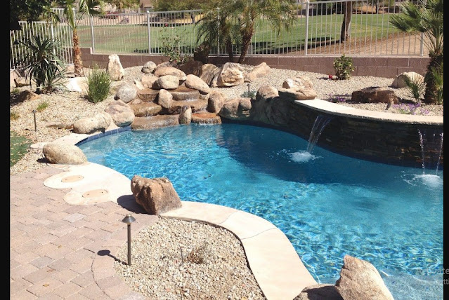 Wall Fountains Outdoor Pool with Minimalist Plants and Neutral Stone Material