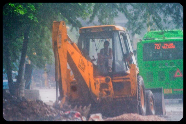 Monsoons in Capital of INDIA ( DELHI ): Posted by VJ Sharma on www.travellingcamera.com : Now monsoon is there in Delhi and probability of traffic jams has increased in capital city of INDIA. Here are few photographs clicked during monsoon season of 2010...As per my definition, Monsoon is a much awaited season after scorching summers and people get bored of this season soon :-)I enjoy rains at times but these should not be continuous... Rains bring freshness in our surroundings but they can ruin many other things due to this continuous behavior... Two senior people struggling with heavy rains and fog of Delhi to reach office in morning @ 10:30 AM... A scene of dense fog near Lodhi estate near India Islamic Center...A scene of dense fog near Lodhi estate near India Islamic Center...Flyover work going on for Common Wealth games in INDIA this year (2010)