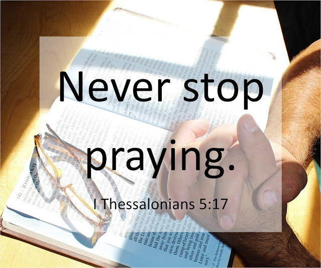 A man's folded hands on top of an open Bible with glasses across the page. Text overlay quotes I Thessalonians 5:17