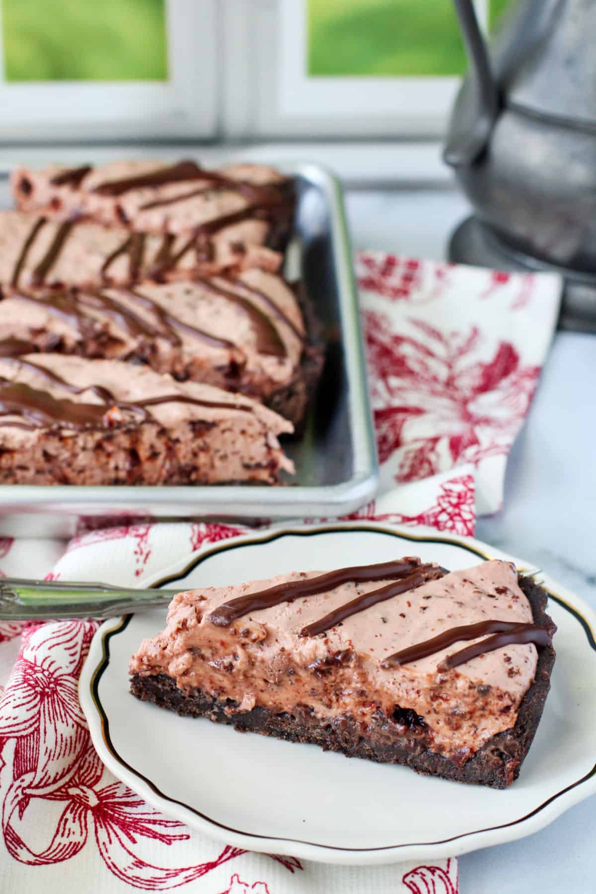 Chocolate Cherry Tart with slices in the background.