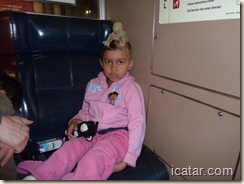 Isabella goofs around on the train
