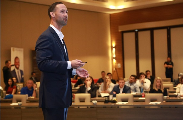 A salesperson is communicating his key messages during a presentation