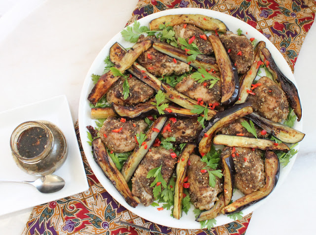 Food Lust People Love: Not your typical salad, this lovely roast za’atar chicken and eggplant salad combines fresh herbs with succulent chicken thighs and golden fried eggplant, drizzled with a tangy pomegranate molasses dressing.