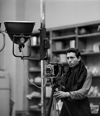 black and white photograph of Tony Vaccaro in the LOOK magazine studio with camera and lights, 1957